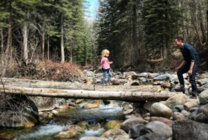 Dad and daughter going on a hike together.