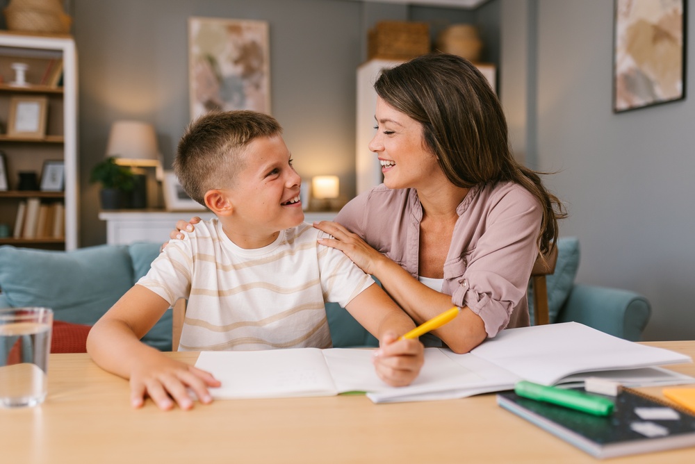 Mother and son talking while doing homework