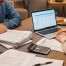Two parents review financial documents
