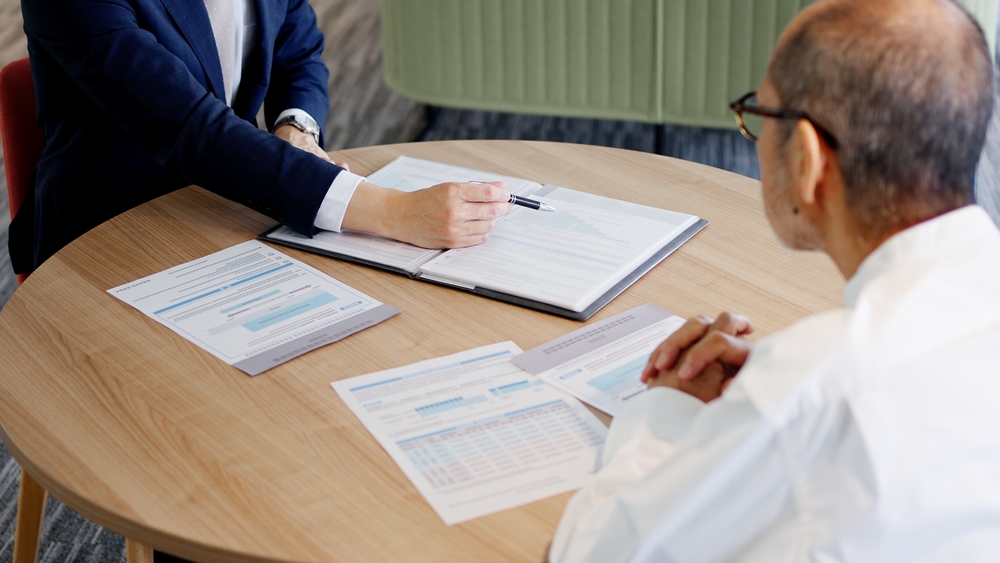 A businessman selling to elderly people