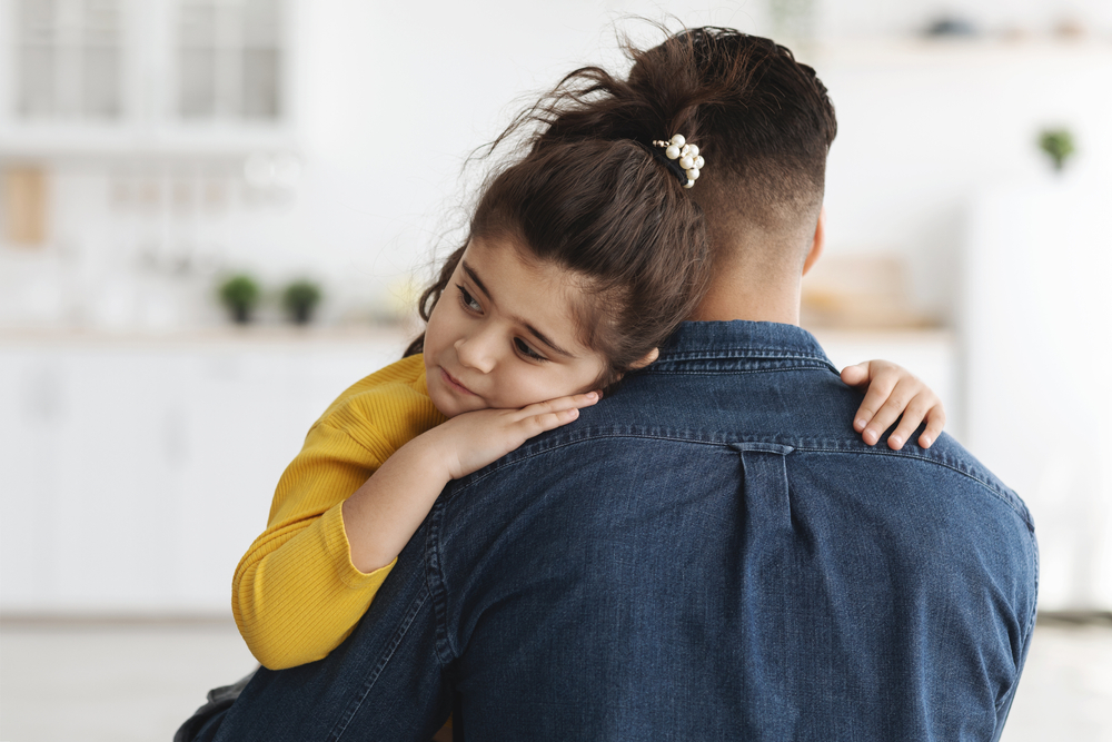 Closeup Shot Of Caring Dad Comforting Upset Little Arab Daughter At Home, Cute Sad Middle Eastern Female Child Hugging Father In Kitchen, Feeling Parent Support And Protection, Free Space