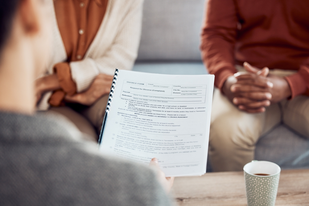 Couple, divorce form and family lawyer for therapy and documents apply for legal advice together.