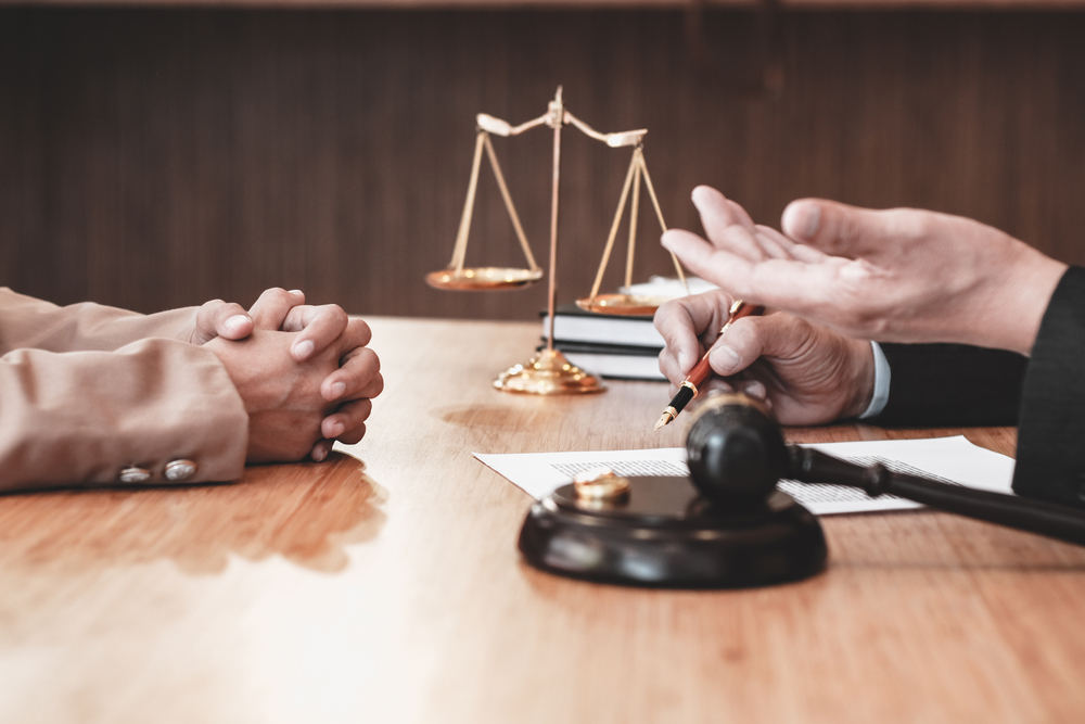 Judge gavel deciding on marriage divorce signing papers. lawyer concept