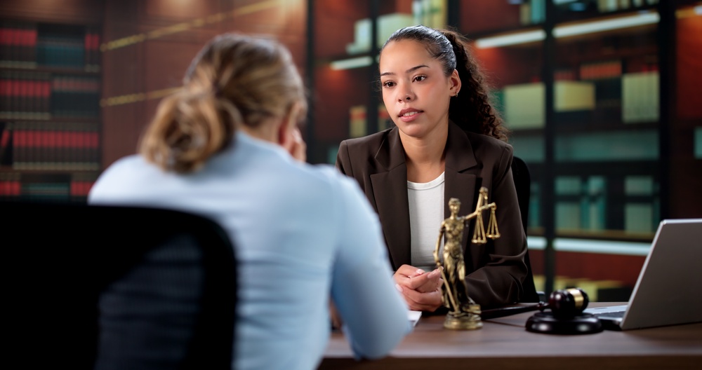 The Sad Attorney Consoles Her Upset Hispanic Client After Hearing.