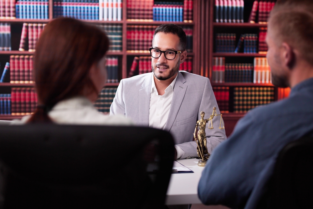 Family Divorce Lawyer Consulting Family Couple In Meeting