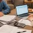 Two parents review financial documents