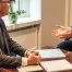 A professional, compassionate divorce lawyer offering legal advice in a calm, supportive setting